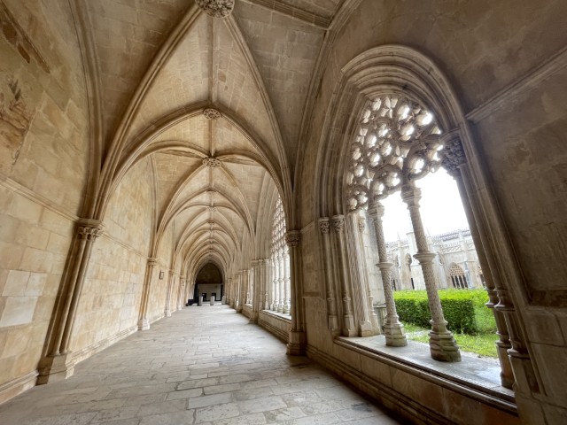 Intricate Manueline and Gothic stone carvings in the cloisters of Batalha Monastery