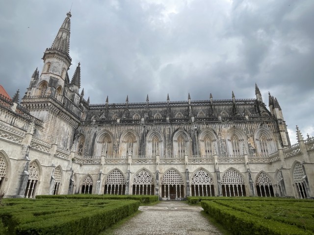 he inner courtyard and manicured green gardens of Batalha Monastery